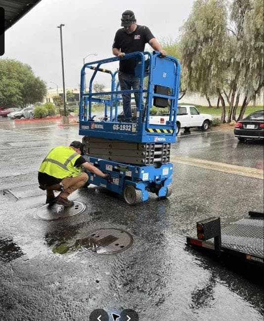 Foutz Electric crew using a lift for commercial site work.