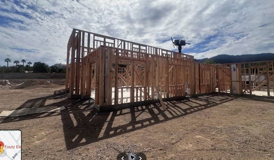 Wood framing at a construction site before electrical rough-in work.